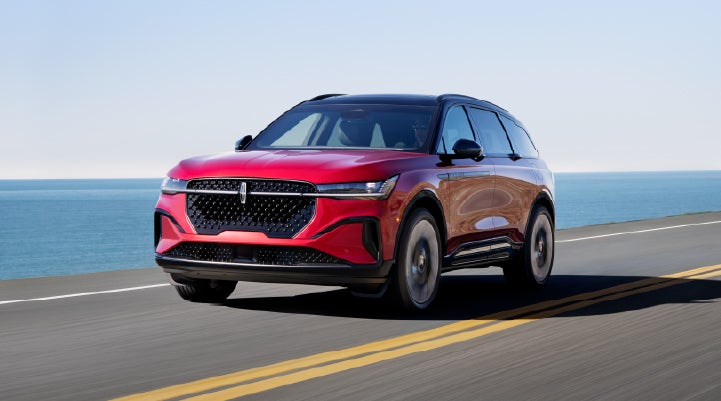 A 2025 Lincoln Nautilus® SUV is being driven on a seaside roadway. | Joe Cooper Lincoln of Edmond in Oklahoma City OK