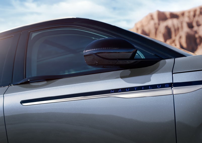 Blue lettering on the side of the vehicle that reads nautilus indicates the available hybrid powertrain. | Joe Cooper Lincoln of Edmond in Oklahoma City OK