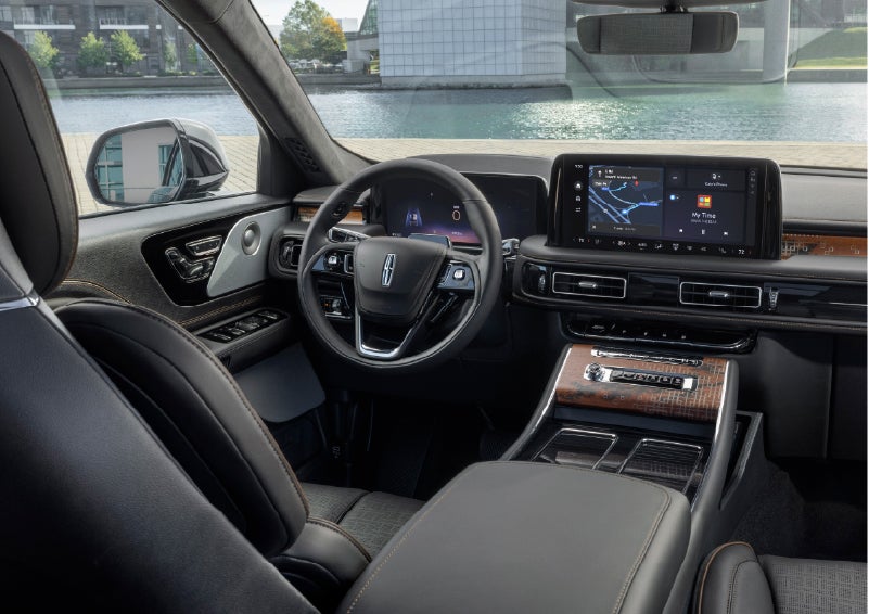 The interior of the 2026 Lincoln Aviator® SUV is shown parked with a view of a harbor through the windshield. | Joe Cooper Lincoln of Edmond in Oklahoma City OK
