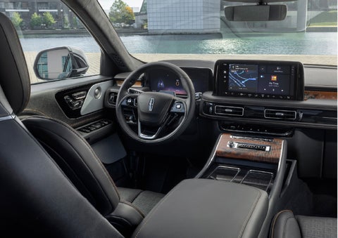 The interior of the 2026 Lincoln Aviator® SUV is shown parked with a view of a harbor through the windshield. | Joe Cooper Lincoln of Edmond in Oklahoma City OK