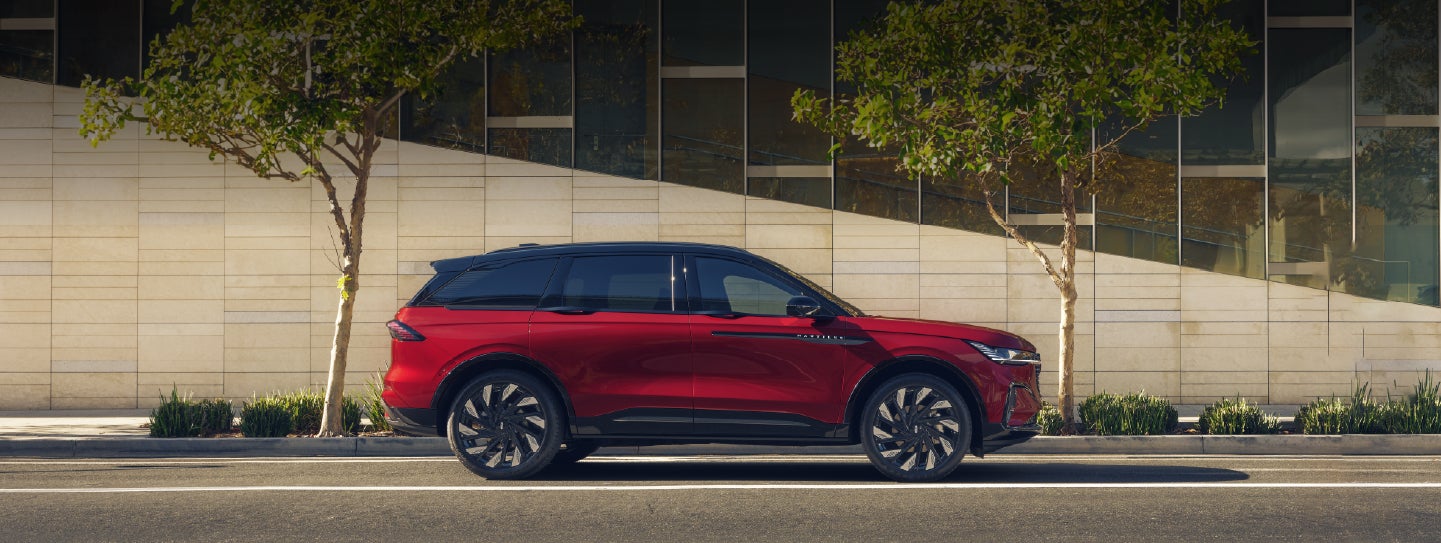 A 2026 Lincoln Nautilus® SUV with an available Hybrid Powertrain is parked in an urban setting. | Joe Cooper Lincoln of Edmond in Oklahoma City OK