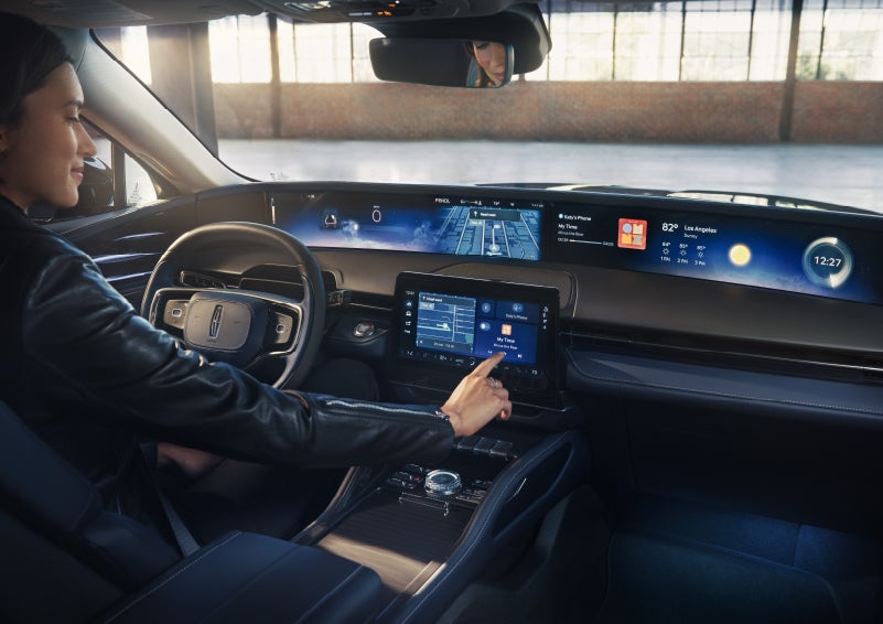 The driver of a 2026 Lincoln Nautilus® SUV interacts with the center touchscreen. | Joe Cooper Lincoln of Edmond in Oklahoma City OK